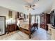 Serene main bedroom with a four-poster bed, dark wood furniture, and soft neutral tones throughout at 725 Ashworth Overlook Dr # C, Apopka, FL 32712