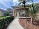 Charming home with a well-lit front entrance and a landscaped walkway at 8012 Old Town Dr, Orlando, FL 32819
