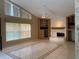 Spacious living room featuring a fireplace, built-in shelving, and tile floors at 8012 Old Town Dr, Orlando, FL 32819