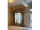 Cozy living space featuring large windows and decorative curtains at 8012 Old Town Dr, Orlando, FL 32819