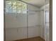 Walk-in closet has wall shelving and a window at 8012 Old Town Dr, Orlando, FL 32819