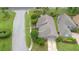 Aerial view of a home nestled in a well-maintained neighborhood with mature landscaping and sidewalks at 849 Bentley Green Cir, Winter Springs, FL 32708