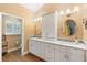 Bathroom featuring wood look flooring, double sinks, and white cabinetry at 849 Bentley Green Cir, Winter Springs, FL 32708
