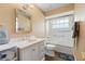 Bathroom featuring a shower-tub combo and a single sink vanity with white cabinetry at 849 Bentley Green Cir, Winter Springs, FL 32708