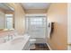 Bright bathroom features a shower over tub, single sink vanity, and medicine cabinet mirror at 849 Bentley Green Cir, Winter Springs, FL 32708