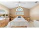 Bedroom with a bed, dresser, stained glass window, and neutral colored walls at 849 Bentley Green Cir, Winter Springs, FL 32708