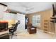 This functional bedroom has a built in desk and shelving, as well as a TV and ceiling fan at 849 Bentley Green Cir, Winter Springs, FL 32708
