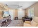 Bonus room with a ceiling fan, comfortable furnishings, and a tv at 849 Bentley Green Cir, Winter Springs, FL 32708