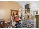 Dining room features wood table, white chairs, and blue floral rug at 849 Bentley Green Cir, Winter Springs, FL 32708