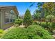 A tranquil setting of lush greenery and tropical plants surrounds this home's rear at 849 Bentley Green Cir, Winter Springs, FL 32708