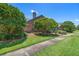 Charming single story brick home surrounded by green grass and mature trees at 849 Bentley Green Cir, Winter Springs, FL 32708