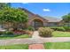 Charming brick home exterior with manicured landscaping at 849 Bentley Green Cir, Winter Springs, FL 32708
