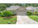 Charming single-story home with a two-car garage and well-maintained lawn at 849 Bentley Green Cir, Winter Springs, FL 32708