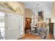 Bright foyer showcasing the front door, arched window, and dining room at 849 Bentley Green Cir, Winter Springs, FL 32708
