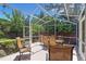 Enjoy outdoor dining in this screened patio area with seating for six at 849 Bentley Green Cir, Winter Springs, FL 32708