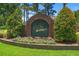 Bentley Green community sign, lush landscaping and manicured lawn at 849 Bentley Green Cir, Winter Springs, FL 32708
