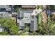 Aerial view showcasing a residential neighborhood with lush green trees at 901 E Pine St # 2, Orlando, FL 32801