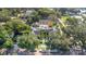 An aerial view of a lovely property surrounded by lush trees and greenery, with neighborhood homes nearby at 901 E Pine St # 2, Orlando, FL 32801