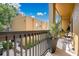 A cozy balcony featuring outdoor seating, a potted plant, and the exterior view of a yellow house at 901 E Pine St # 2, Orlando, FL 32801