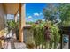 Cozy balcony featuring lush hanging plants, outdoor seating, and tranquil views at 901 E Pine St # 2, Orlando, FL 32801