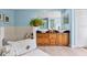 Bathroom with dual sinks, wood cabinets, and tiled tub at 901 E Pine St # 2, Orlando, FL 32801