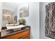 Bathroom featuring a modern sink, wood cabinet, and a patterned hand towel at 901 E Pine St # 2, Orlando, FL 32801