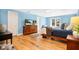 Bedroom with hardwood floors, dresser, television and access to the outside at 901 E Pine St # 2, Orlando, FL 32801
