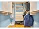 Walk-in closet provides shelving, hanging clothes, and storage at 901 E Pine St # 2, Orlando, FL 32801
