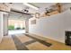 Well-lit garage featuring an open door and an organized overhead storage system at 901 E Pine St # 2, Orlando, FL 32801