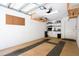 Spacious garage with an organized design, storage shelves, and a patterned floor at 901 E Pine St # 2, Orlando, FL 32801