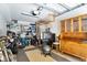 Cluttered garage featuring a storage unit, exercise equipment, and sports gear at 901 E Pine St # 2, Orlando, FL 32801