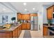 Spacious kitchen featuring stainless steel appliances, tile floors, and granite countertops at 901 E Pine St # 2, Orlando, FL 32801