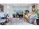 Cozy living room featuring a large TV, comfortable seating, and stylish decor at 901 E Pine St # 2, Orlando, FL 32801