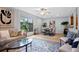 Inviting living room flowing into the dining area, featuring light walls and modern decor at 901 E Pine St # 2, Orlando, FL 32801