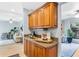 Living room and kitchen view showcasing wood cabinets, open layout, and stylish finishes at 901 E Pine St # 2, Orlando, FL 32801
