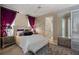 Bedroom featuring a decorative headboard, mirrored closet doors, and stylish decor at 9142 Southern Breeze Dr, Orlando, FL 32836