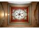 Elaborate ceiling design with an intricate painted pattern and contemporary chandelier at 9142 Southern Breeze Dr, Orlando, FL 32836