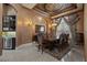 Elegant dining room with chandelier lighting, large windows, and custom ceiling at 9142 Southern Breeze Dr, Orlando, FL 32836