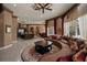 Spacious living room features custom ceiling detail, designer furnishings and seamless flow into the gourmet kitchen at 9142 Southern Breeze Dr, Orlando, FL 32836