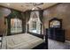 Spacious main bedroom with patio access and custom window treatments at 9142 Southern Breeze Dr, Orlando, FL 32836