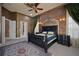 Luxurious main bedroom with custom ceiling, designer rug and custom window treatments at 9142 Southern Breeze Dr, Orlando, FL 32836