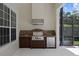 Covered outdoor kitchen area with a stainless steel grill, dark wooden cabinets, and granite countertops at 9142 Southern Breeze Dr, Orlando, FL 32836