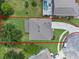 Aerial view of a property with a well-maintained yard, pool, and outlined property line at 9319 Marsh Oaks Ct, Orlando, FL 32832