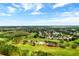 An aerial view of the golf course and residential homes of a beautiful Primary-planned community at 9319 Marsh Oaks Ct, Orlando, FL 32832