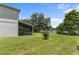 Well-maintained backyard featuring screened-in lanai and serene pond view with a fountain at 9319 Marsh Oaks Ct, Orlando, FL 32832