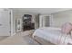 Primary bedroom featuring a large dresser with a modern TV and decor at 9319 Marsh Oaks Ct, Orlando, FL 32832
