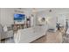 Cozy living room with hardwood floors and access to other areas of the home at 9319 Marsh Oaks Ct, Orlando, FL 32832