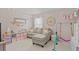 Playful living room featuring a large couch and colorful decor at 9319 Marsh Oaks Ct, Orlando, FL 32832
