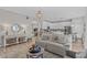 Inviting living room featuring hardwood floors, neutral paint, and an open layout at 9319 Marsh Oaks Ct, Orlando, FL 32832