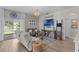 Open living area with stylish decor and views of the tranquil pond at 9319 Marsh Oaks Ct, Orlando, FL 32832